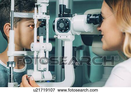 Stock Photo - Slit lamp eye examination. Fotosearch