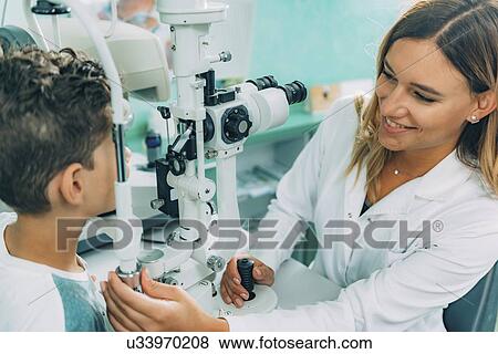 Stock Photo - Slit lamp eye examination. Fotosearch
