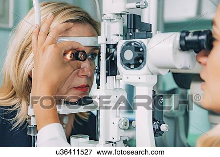 Stock Photo - Slit lamp eye examination. Fotosearch