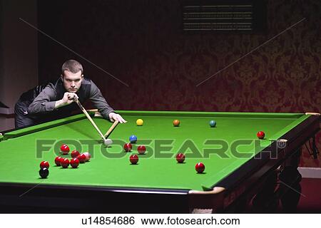 Snooker player taking a shot View Large Photo Image Stock Photograph - Snooker player taking a shot. Fotosearch