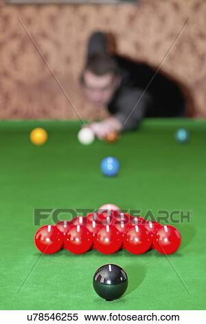 Stock Photography - Snooker player taking a shot. Fotosearch