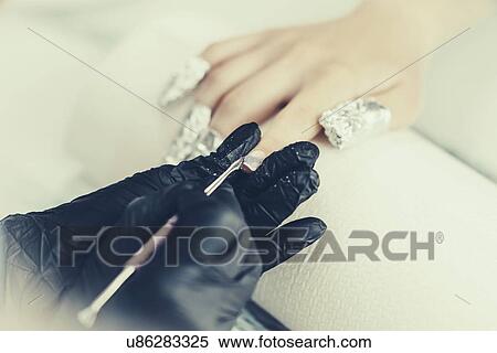 Soaking off gel manicure View Large Photo Image Stock Photography - Soaking off gel manicure. Fotosearch
