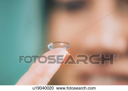 Soft contact lens insertion View Large Photo Image Stock Image - Soft contact lens insertion. Fotosearch
