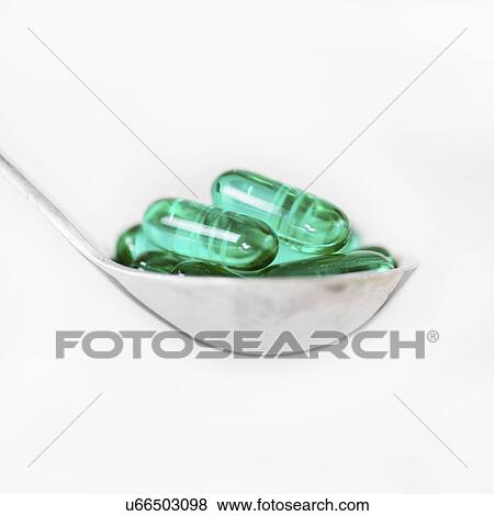 Stock Photo - Spoonful of supplements. Fotosearch
