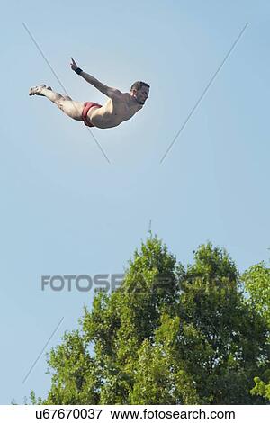 Swan dive from high platform View Large Photo Image Stock Photo - Swan dive from high platform. Fotosearch