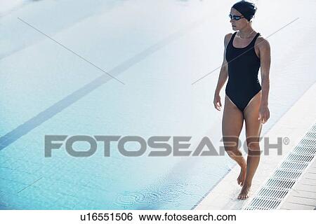 Stock Photograph - Swimmer next to pool. Fotosearch
