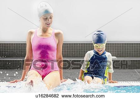 Swimming instructor and little boy View Large Photo Image Stock Image - Swimming instructor and little boy. Fotosearch