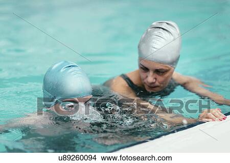Swimming lesson View Large Photo Image Picture - Swimming lesson. Fotosearch