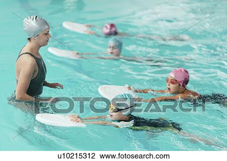 Stock Image - Swimming lesson. Fotosearch