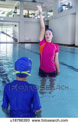 Stock Image - Swimming lesson. Fotosearch