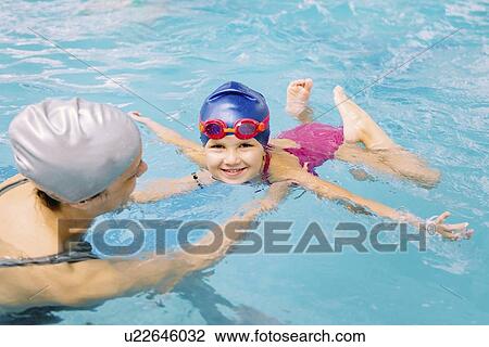 Stock Image - Swimming lesson. Fotosearch