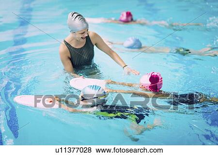 Stock Photo - Swimming lesson. Fotosearch