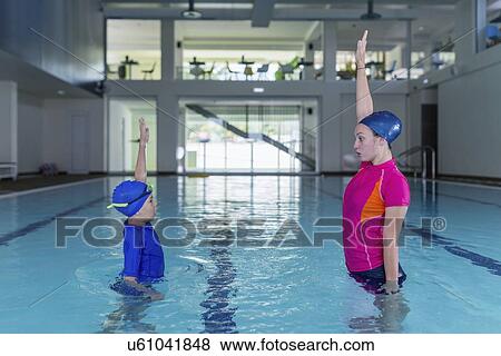 Stock Photo - Swimming lesson. Fotosearch