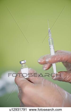 Syringe and vaccine vial View Large Photo Image Stock Image - Syringe and vaccine vial. Fotosearch