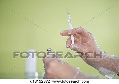 Syringe and vaccine vial View Large Photo Image Stock Image - Syringe and vaccine vial. Fotosearch