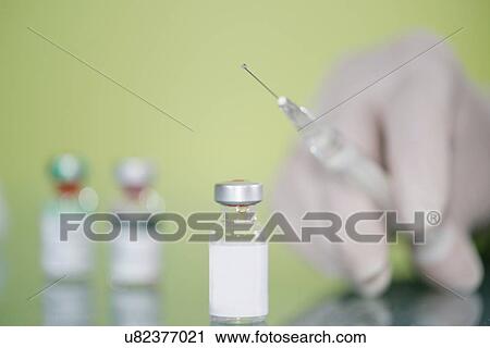 Syringe and vaccine vial View Large Photo Image Stock Image - Syringe and vaccine vial. Fotosearch