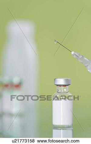 Syringe and vaccine vial View Large Photo Image Stock Photo - Syringe and vaccine vial. Fotosearch