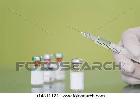 Syringe and vaccine vials View Large Photo Image Stock Image - Syringe and vaccine vials. Fotosearch