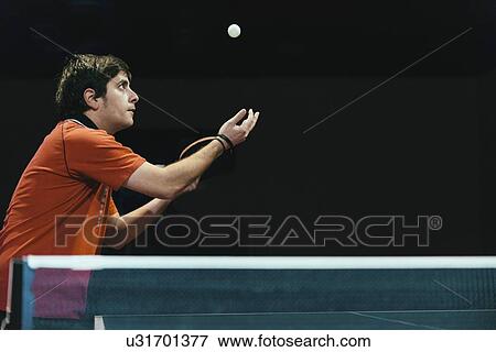 Stock Photo - Table tennis player serving. Fotosearch