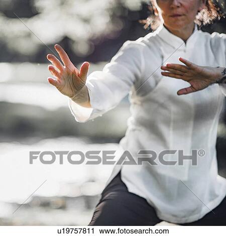 Stock Image - Tai Chi practice. Fotosearch