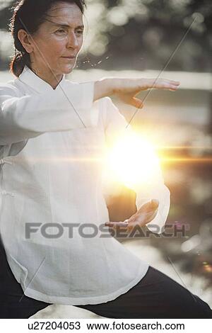Stock Image - Tai Chi practice. Fotosearch