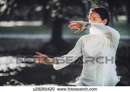 Stock Image - Tai Chi practice. Fotosearch