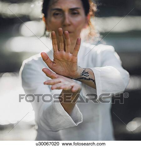 Stock Image - Tai Chi practice. Fotosearch