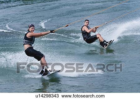 Tandem wakeboarding View Large Photo Image Stock Image - Tandem wakeboarding. Fotosearch