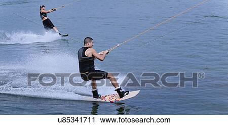 Tandem wakeboarding View Large Photo Image Stock Image - Tandem wakeboarding. Fotosearch