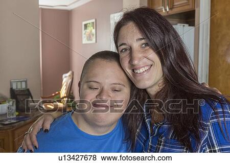 Stock Photo - Teen boy with Down Syndrome and friend. Fotosearch