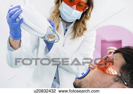 Stock Image - Teeth whitening. Fotosearch