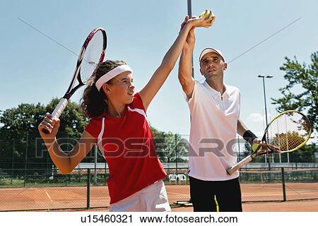 Stock Image - Tennis lesson. Fotosearch
