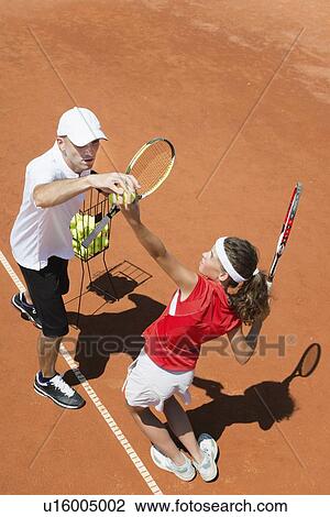 Stock Image - Tennis lesson. Fotosearch