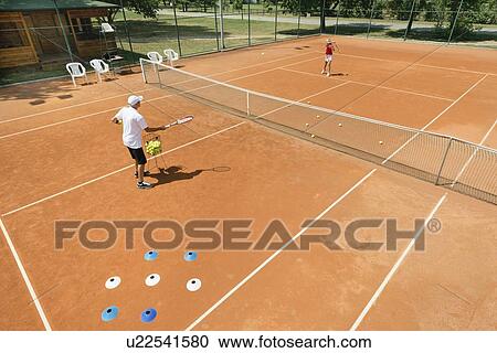 Stock Image - Tennis lesson. Fotosearch