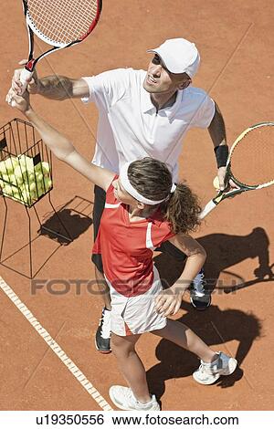 Tennis lesson View Large Photo Image Stock Photograph - Tennis lesson. Fotosearch