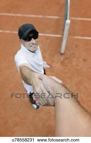 Tennis player shaking hands with chair umpire View Large Photo Image Stock Image - Tennis player shaking hands with chair umpire. Fotosearch