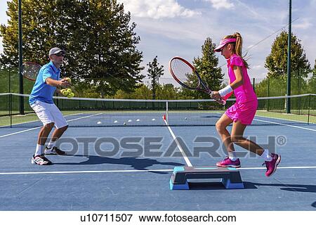 Tennis training View Large Photo Image Stock Photo - Tennis training. Fotosearch