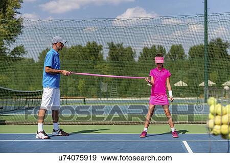 Tennis training View Large Photo Image Stock Photo - Tennis training. Fotosearch