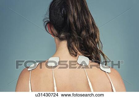Picture - TENS therapy. Fotosearch