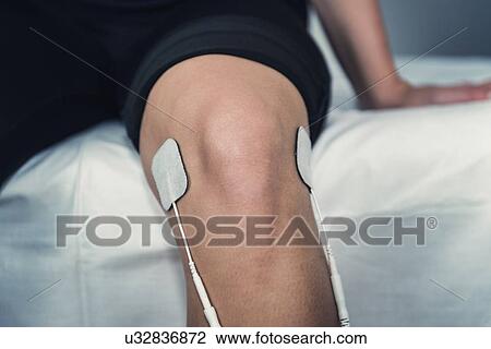 Stock Image - TENS therapy. Fotosearch