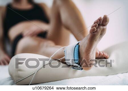 Picture - TENS treatment for ankle. Fotosearch