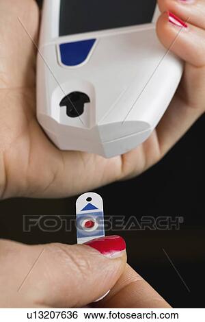 Testing blood glucose levels View Large Photo Image Stock Photograph - Testing blood glucose levels. Fotosearch