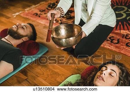 Picture - Tibetan singing bowl therapy. Fotosearch