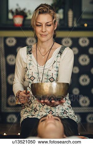 Tibetan singing bowl therapy View Large Photo Image Stock Image - Tibetan singing bowl therapy. Fotosearch