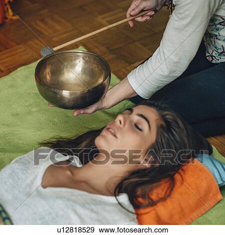 Tibetan singing bowl therapy View Large Photo Image Stock Photo - Tibetan singing bowl therapy. Fotosearch