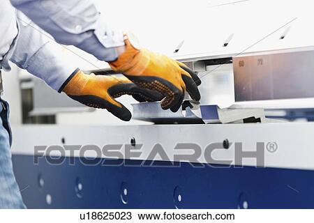 Stock Image - Tin folding machine. Fotosearch