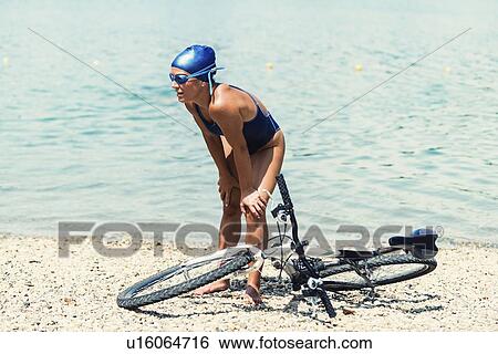Tired triathlete View Large Photo Image Stock Photograph - Tired triathlete. Fotosearch