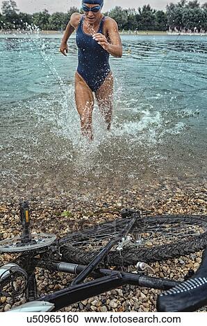 Stock Image - Triathlete in training. Fotosearch