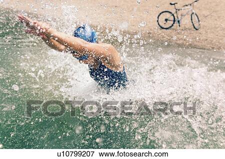 Stock Photo - Triathlete in training. Fotosearch