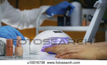 UV lamp for setting nails View Large Photo Image Stock Photograph - UV lamp for setting nails. Fotosearch